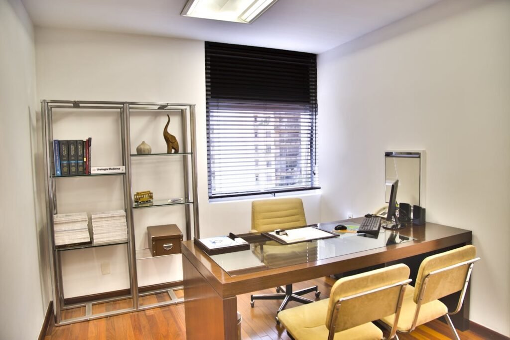 pexels photo 263209 Sleek and contemporary office space featuring a wooden desk, chairs, and organized shelves.