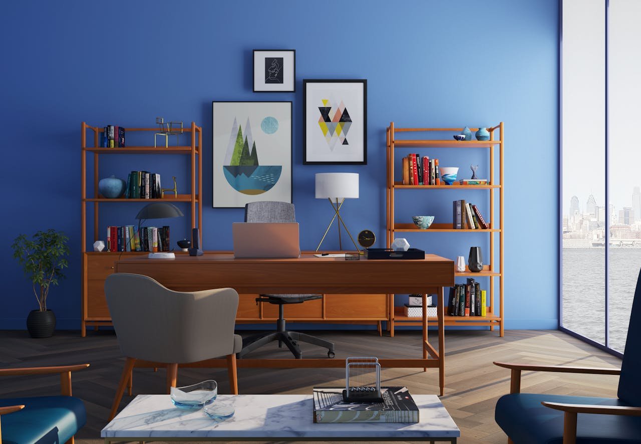 about-me Elegantly decorated home office with modern furniture and a blue wall.
